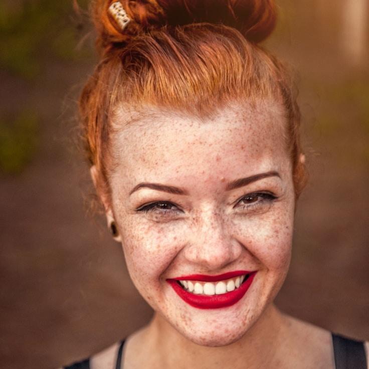 Amira Patel, Lead Design Curator at Path Orchid Novel, reviewing corporate floral arrangements